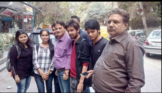 RK Mishra teaching students with individual attention